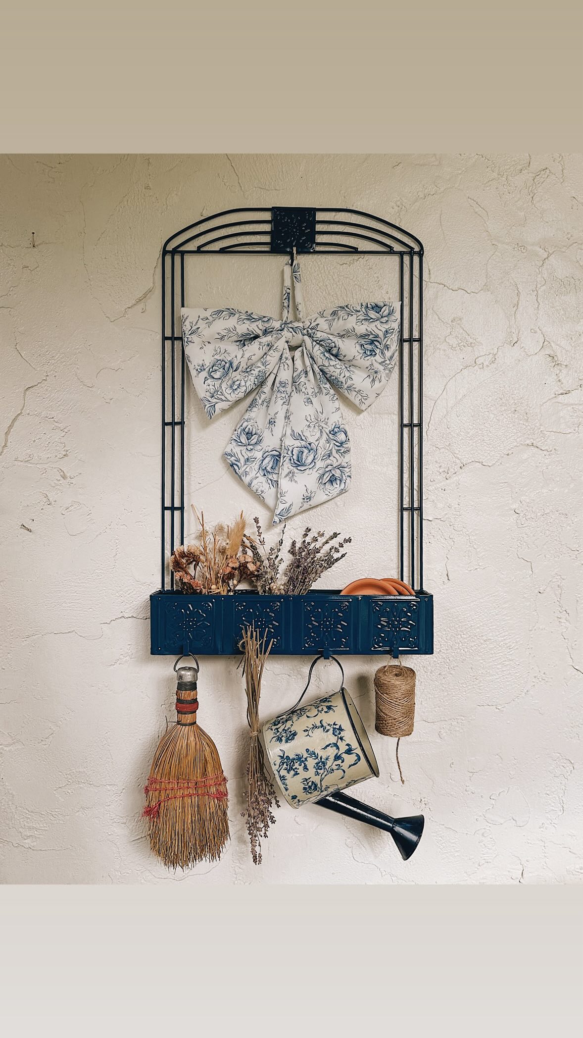 Each thrifted treasure has an untold story, and you have the ability to write its next chapter 📖
While spray paint is not always the answer, you can’t deny that sometimes it’s exactly what a piece needs.

👩🏻‍🎨Comment “SUPPLIES” and I’ll send you everything I used to transform this metal wall planter. I’ll also break down exactly how I styled it in another reel soon.

Each year, I add more character and personality to our front porch with a mix of modern and vintage finds. When I first came across this metal wall planter, I knew it belonged on our front porch. Once I brought it home, though, I was pretty underwhelmed. The white planter disappeared into our white stucco walls.

I did some research and came across @rustoleum ‘s Evening Navy - a deep, rich, French blue. After one coat of blue and a clear coat to seal and protect, the planter was ready to hang. Now that I’ve made it my own - it feels like it was always meant to be.💙

Metal wall-mount planter sourced from @heartsthriftstores ♥️